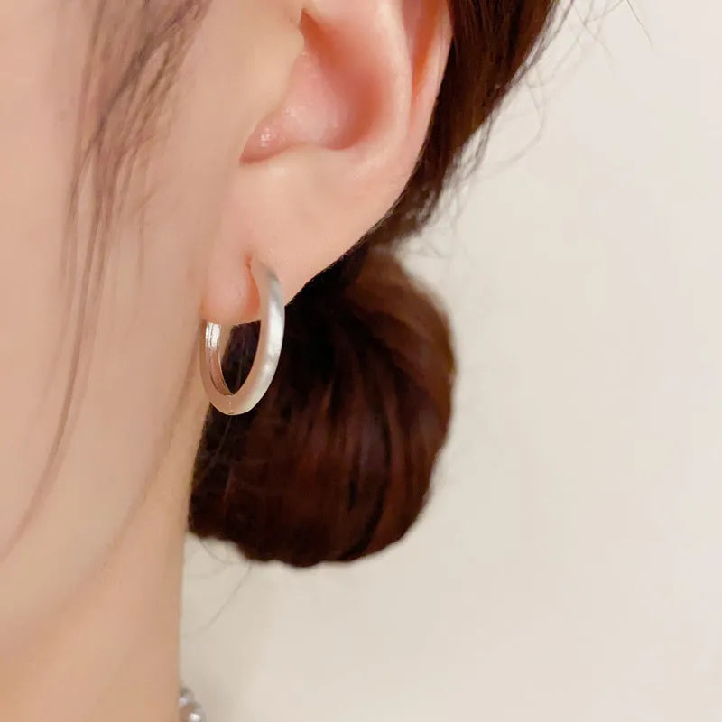Geometric round eyelet ear clip jewellery in gold colour with real gold plating on copper material