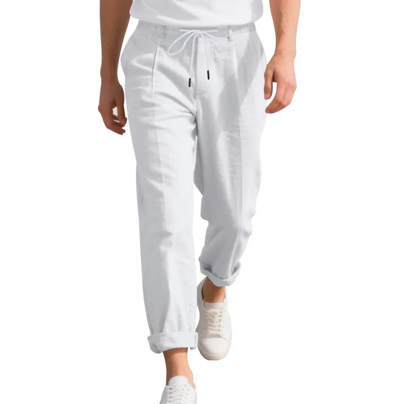 Men's light khaki linen casual trousers with a drawstring waistband and straight-leg silhouette.