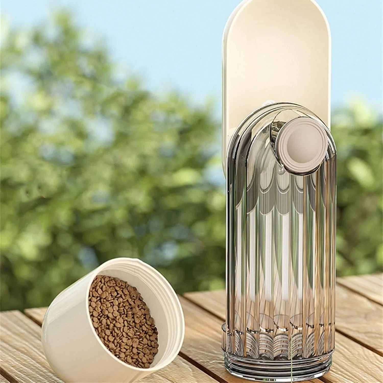 Beige or green foldable dog water bottle with food container, showing large drinking opening and compact size.