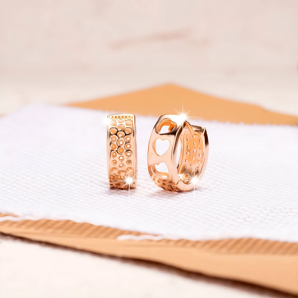 Rose gold hollowed out heart earrings with three circular cut-outs inside, circular shape, fresh sweet style.