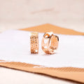 Rose gold hollowed out heart earrings with three circular cut-outs inside, circular shape, fresh sweet style.