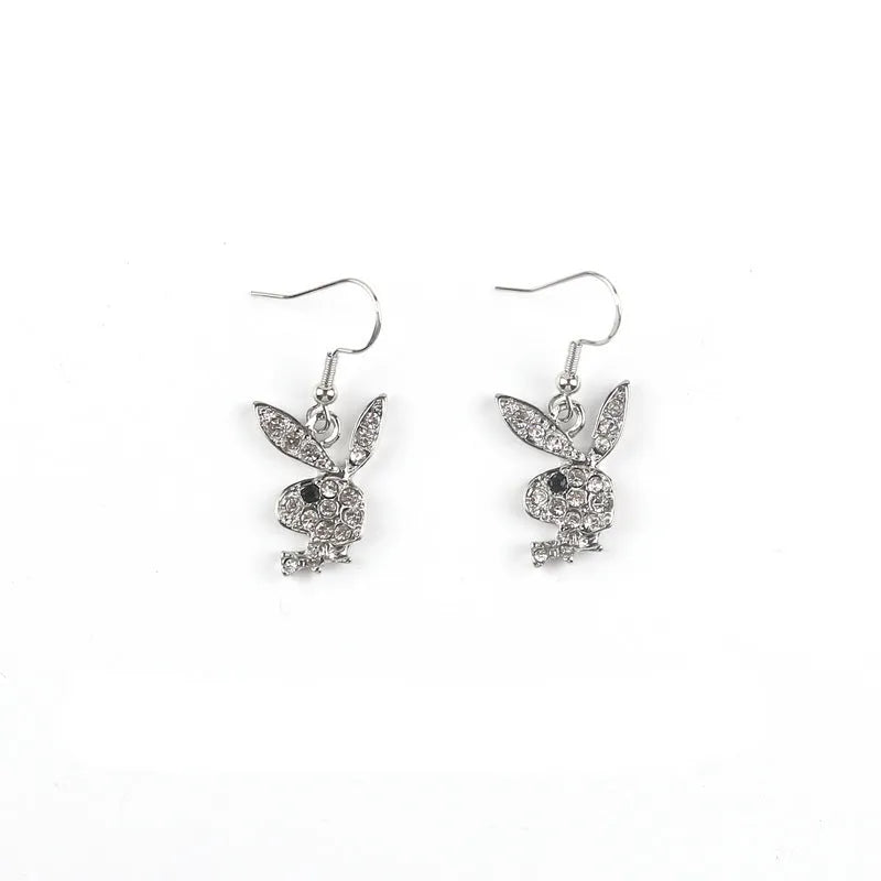 Close-up of cute rabbit stud earrings with full diamond face, in silver, pink, or gold alloy.