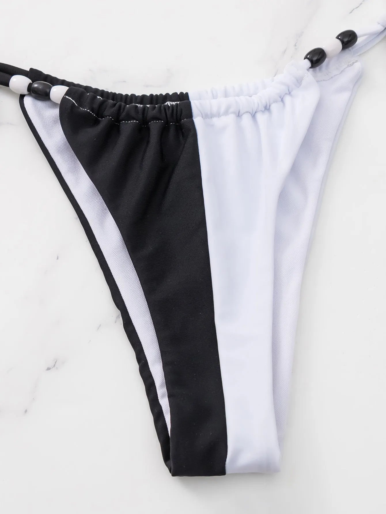 Women's lace-up triangle cup bikini set in black and white nylon polyester