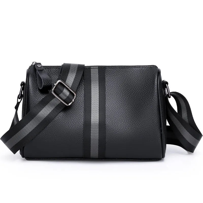 Black genuine leather crossbody bag showing single shoulder strap and structured 24x16x13cm design.