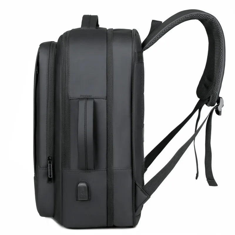 Black or grey waterproof oxford cloth backpack with curved shoulder straps showing 20-35 litre capacity