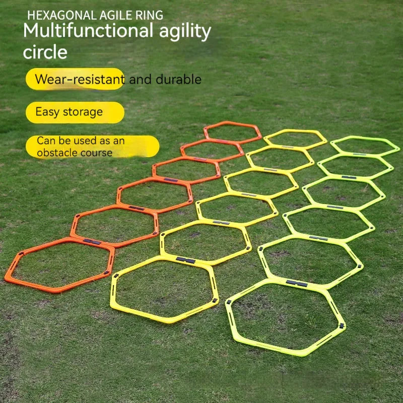 Set of six foldable yellow, green, and orange hexagon agility training rings on grass.