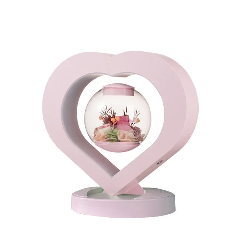 Pink preserved real rose ornament in a decorative case with optional base and Bluetooth speaker.