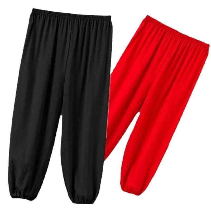 Black children's high-elasticity Sanda practice pants made from Lycra fabric, laid flat.
