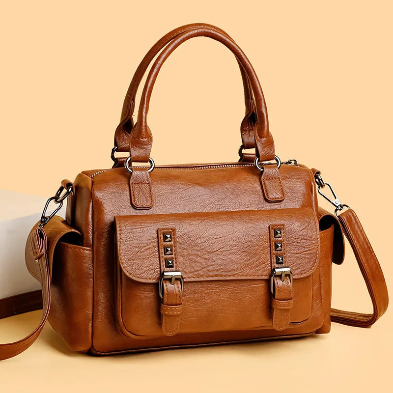Large capacity vintage messenger bag in horizontal square shape, shown in available colours: blue, gray, camel, red, black, brown.