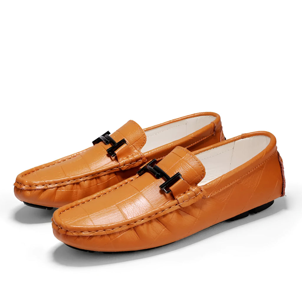 Men's black casual leather shoes with a silver belt buckle and flat rubber sole.