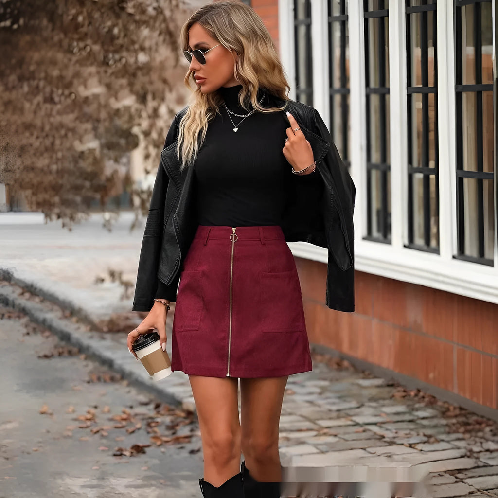 Women's black high waist hip skirt with front zipper closure and stitching detail on mannequin