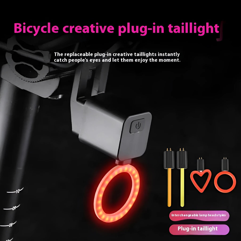 USB rechargeable bicycle running water tail light with silicone strap mount on a bike seat tube.
