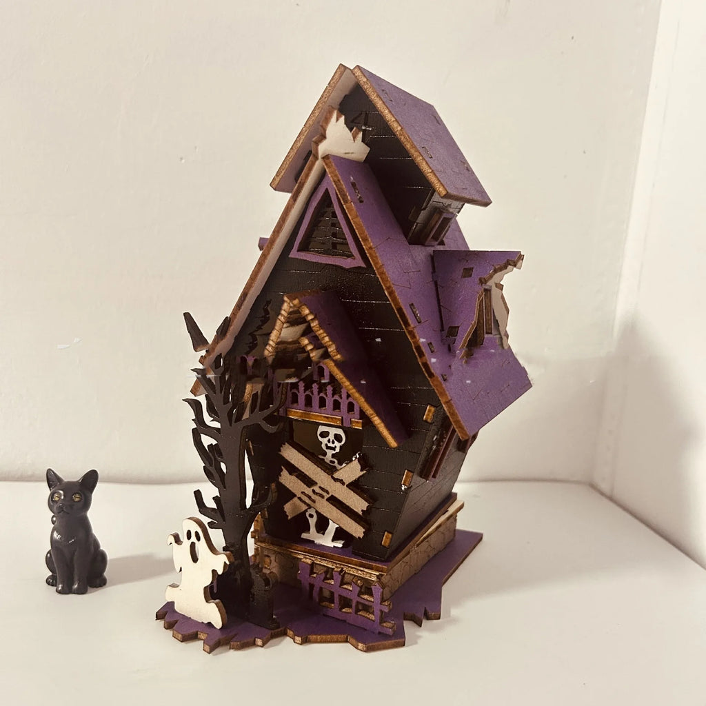 Wooden Halloween haunted house table decoration with luminous glowing design measuring 14 cm wide