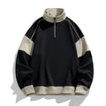 Man wearing a thin black hooded corduroy sweatshirt with drop shoulder and loose lapels.