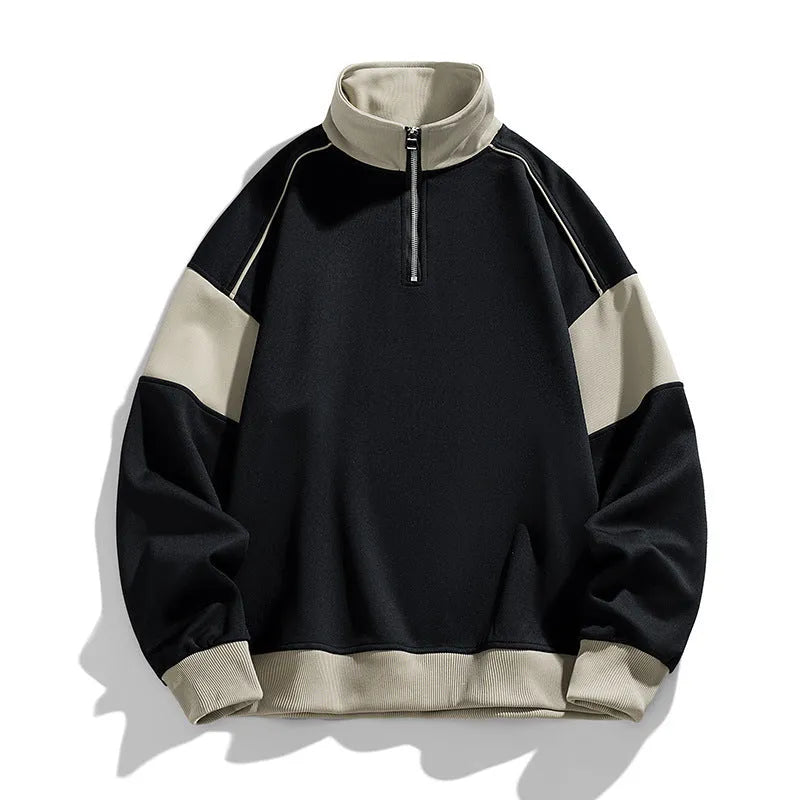Man wearing a thin black hooded corduroy sweatshirt with drop shoulder and loose lapels.