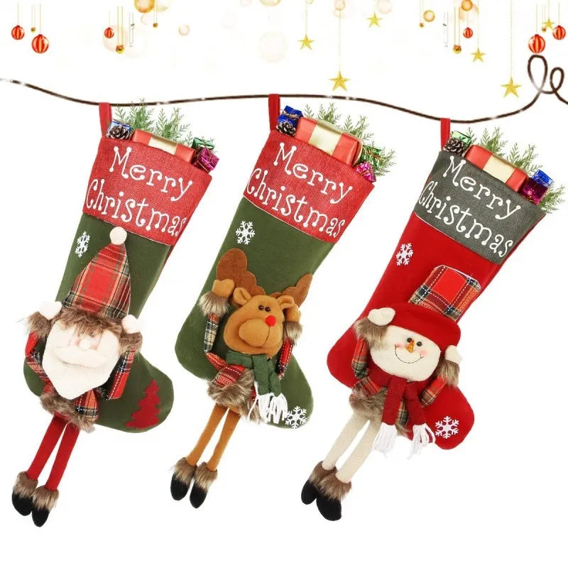 Set of three large Christmas stockings with Santa, Snowman, and Reindeer 3D designs hanging on a fireplace