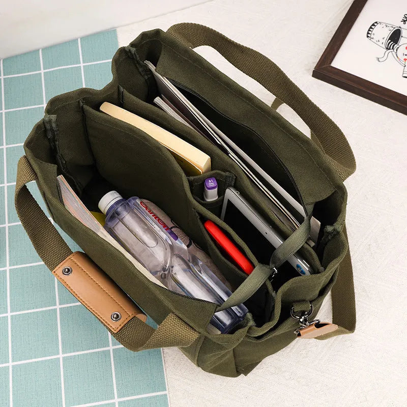 Large canvas tote bag with multiple internal compartments in horizontal square design
