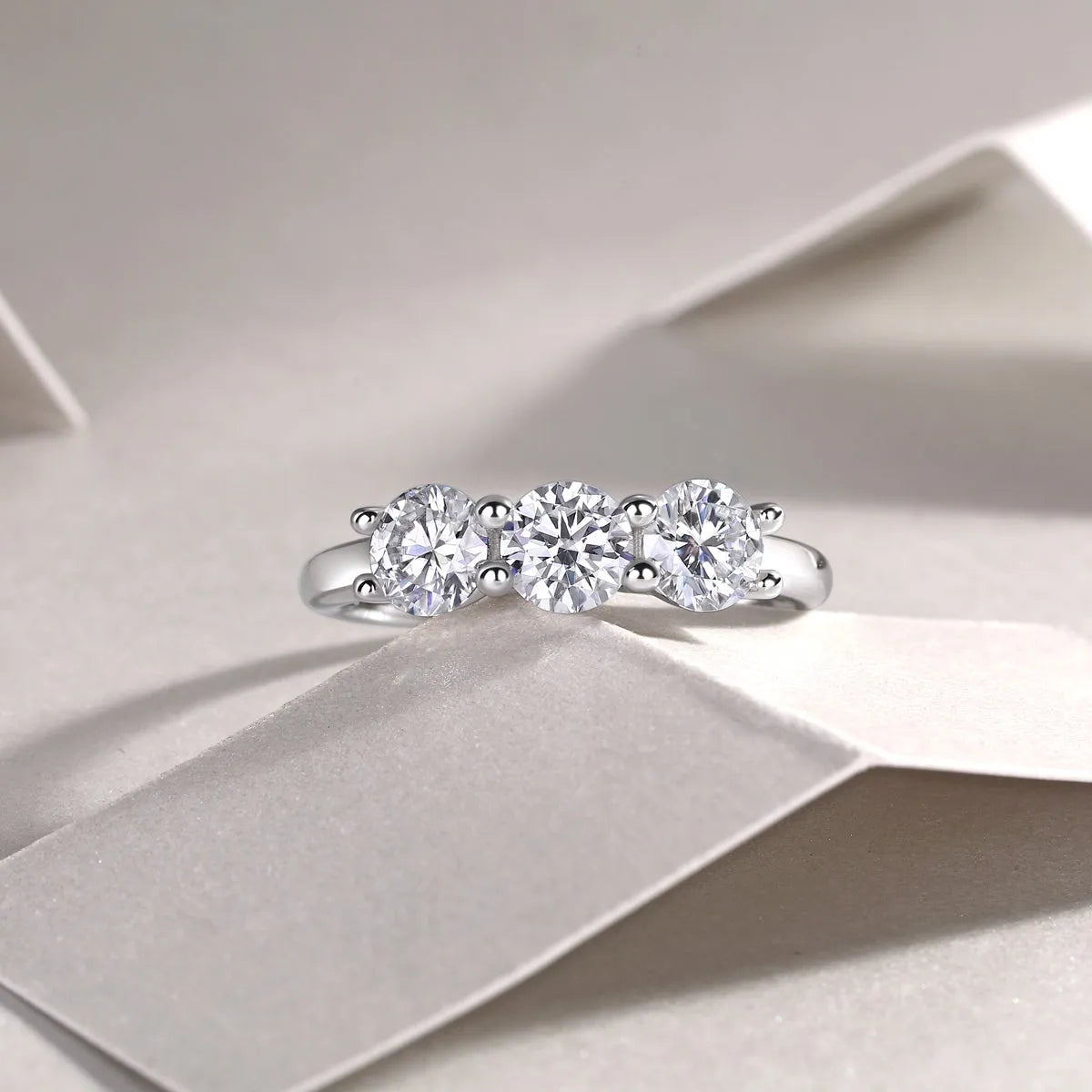 0.5 carat moissanite wedding ring set in S925 silver with platinum plating, gold colour, on white background