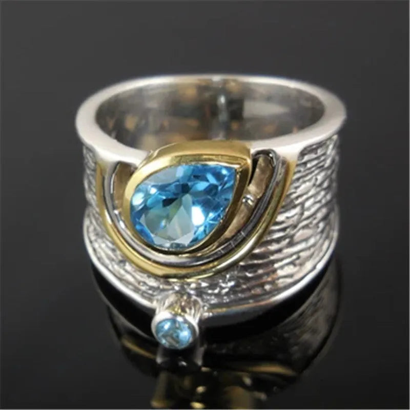 Blue Chinese style drop shape ring with rhinestone zircon inlay on alloy band showing women's jewellery