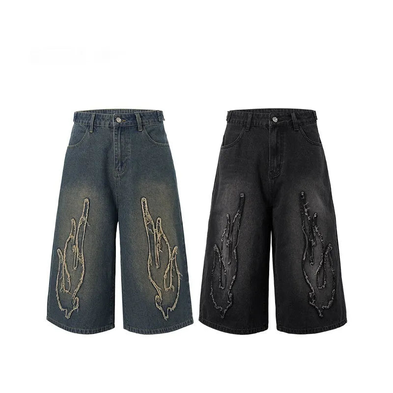 Men's black cotton denim shorts with flame embroidery detailing on straight cut casual design
