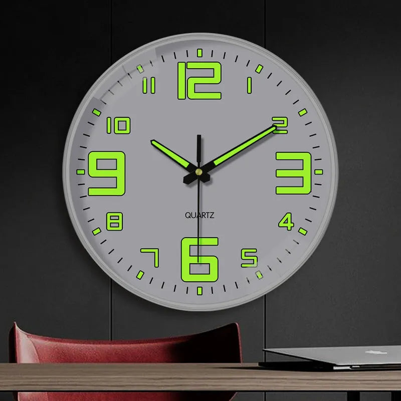 8 inch modern wall clock with luminous hands and black numerals on a light dial.