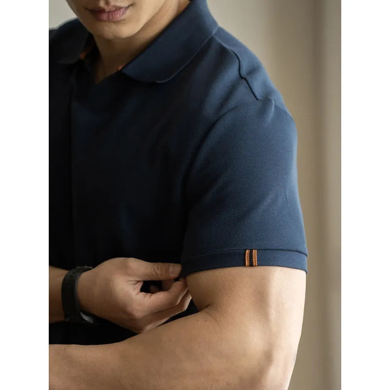 Men's blue short-sleeved cotton blend polo shirt on a hanger, showing regular fit and casual style.