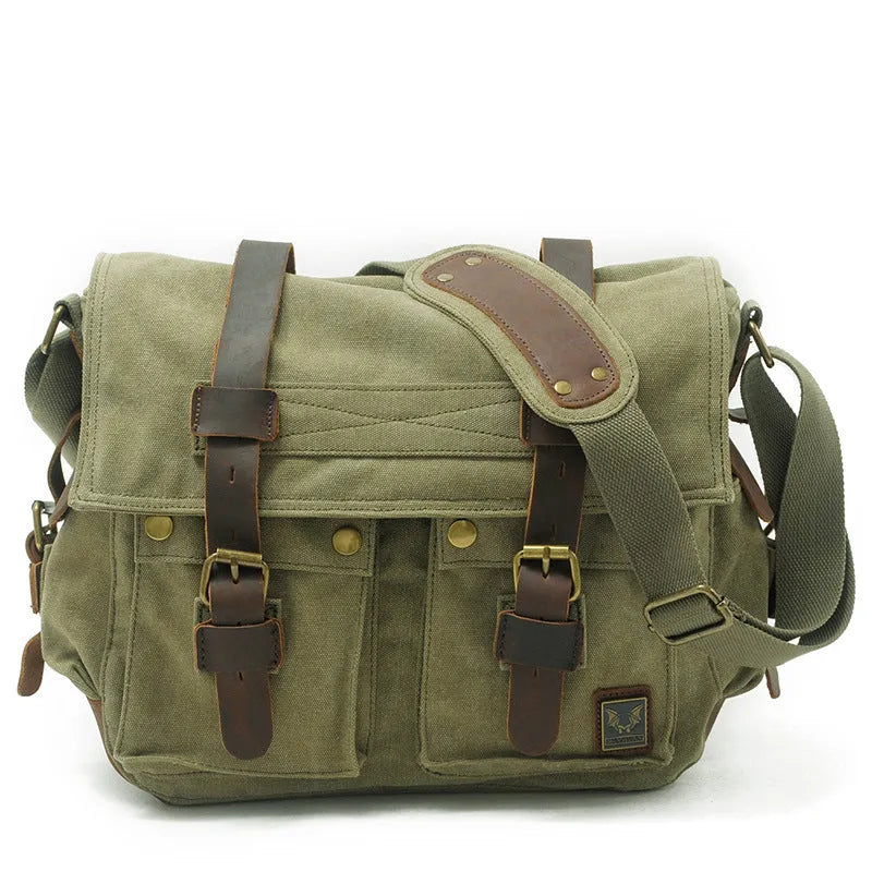 Men's army green canvas crossbody flap bag with leather trim shown open, revealing internal phone and document pockets.
