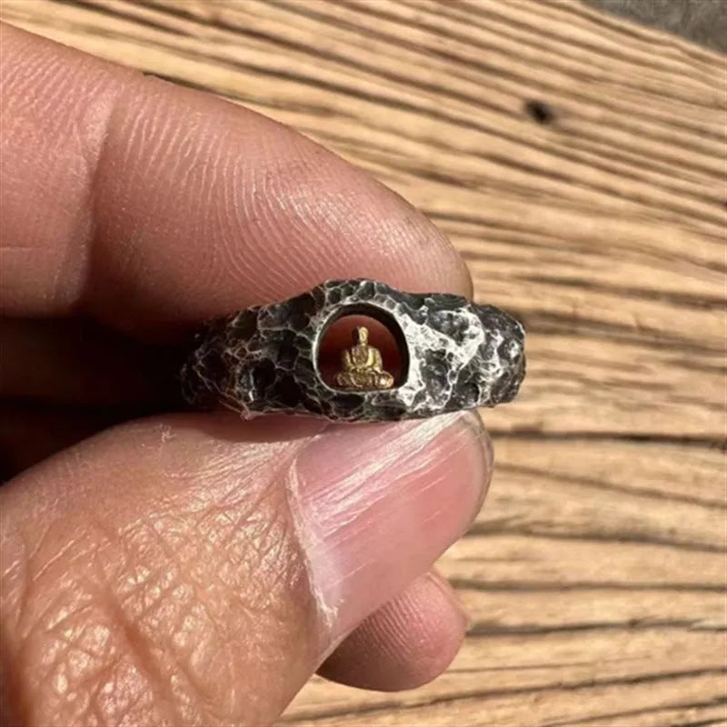 Hand-forged copper Grotto Buddha ring with rock texture on a size 8 band.