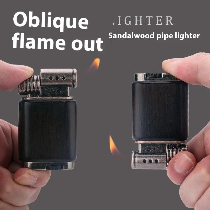 Black wood gas lighter with rosewood decorative finishes including sun face design