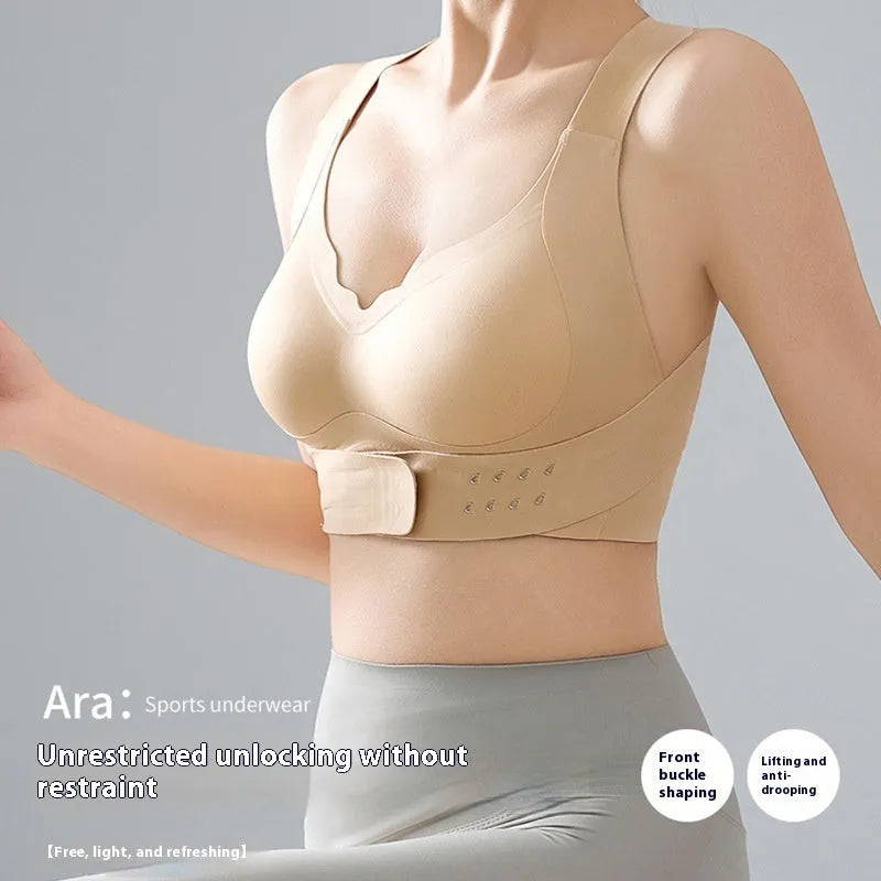 Women's black sports bra with front buckle closure and contoured back design for yoga.