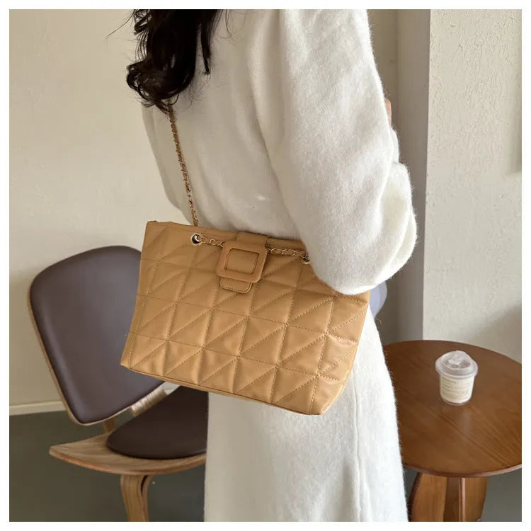 Women shoulder bag in trapezoid shape with chain strap, PU material, three-dimensional pocket, available in black white khaki brown