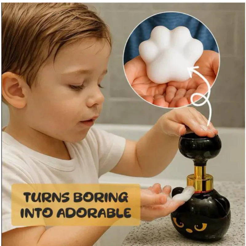 Black plastic cat-shaped cartoon foam soap dispenser pump bottle on a countertop.