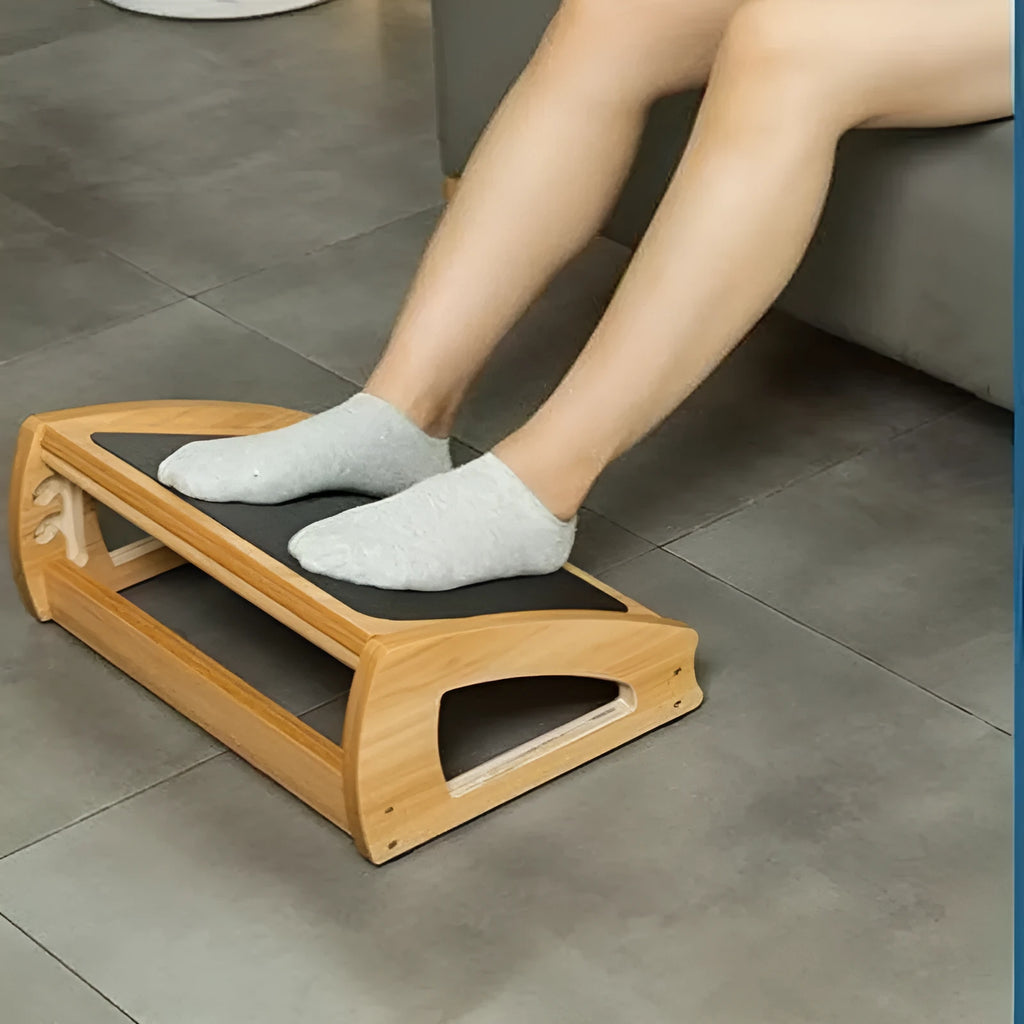 Natural wood colour adjustable bamboo office desk footstool showing height adjustment mechanism