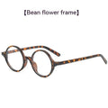 Round retro glasses with artistic frame in four colour options: bright black, sand black, tofu pudding, transparent grey.