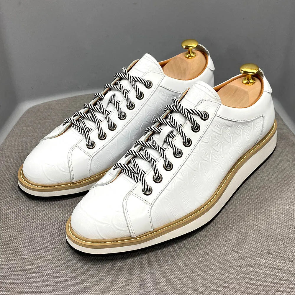 Men's white low-top casual shoes with a patterned embossed upper and front lace closure.