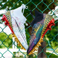 Men's high-top football training shoes with gold plated bottom on PVC sole, in white, black, and mandarin duck colours.