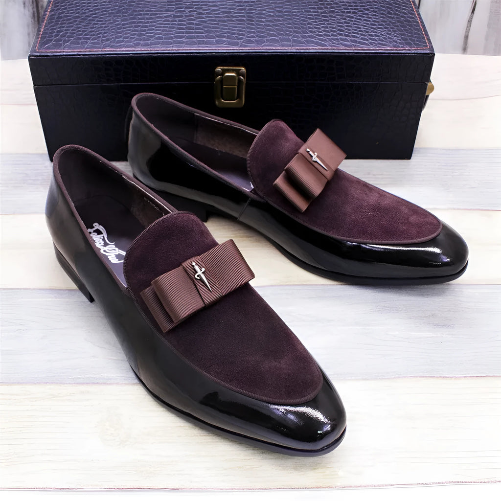 Men's glossy patent leather low-top shoes with a tassel in black, shown from a side view.