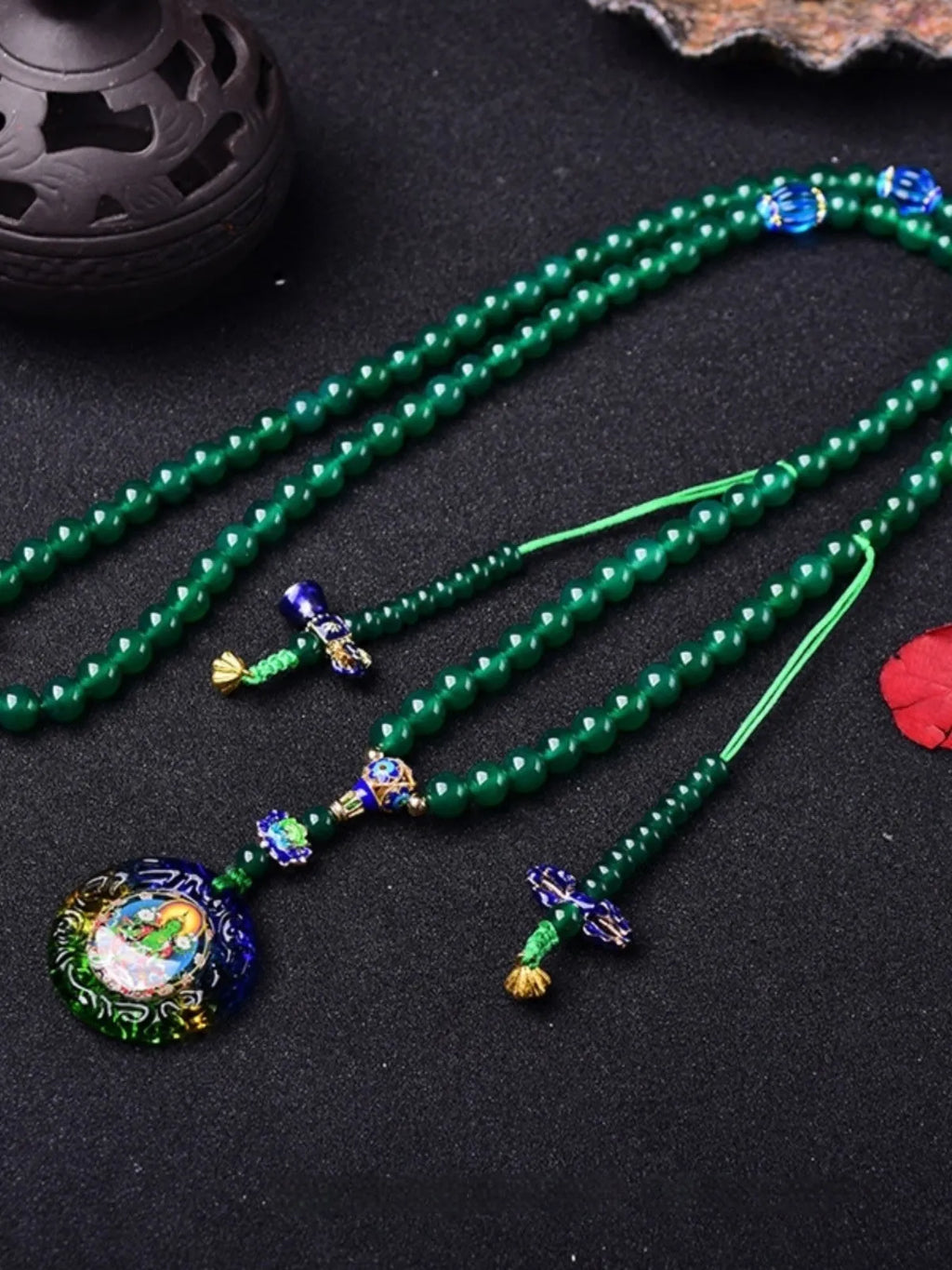 Handmade natural green agate Thangka pendant multi-circle bracelet on wrist.
