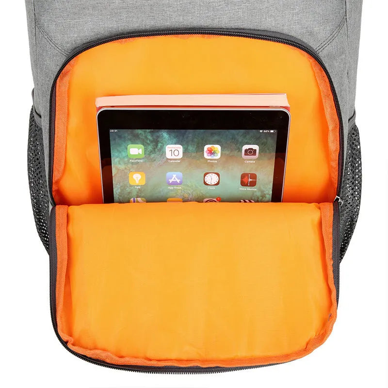 Large black outdoor thermal picnic backpack with curved shoulder straps on a gray background.