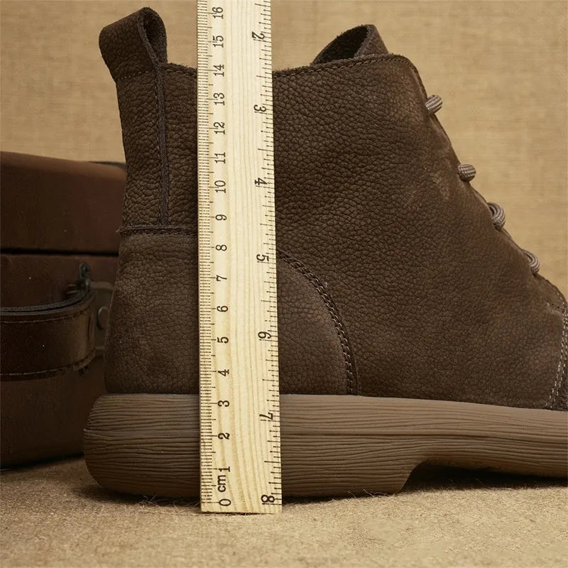 Grey genuine leather women's Martin boots with wedge heel and front lace-up design.