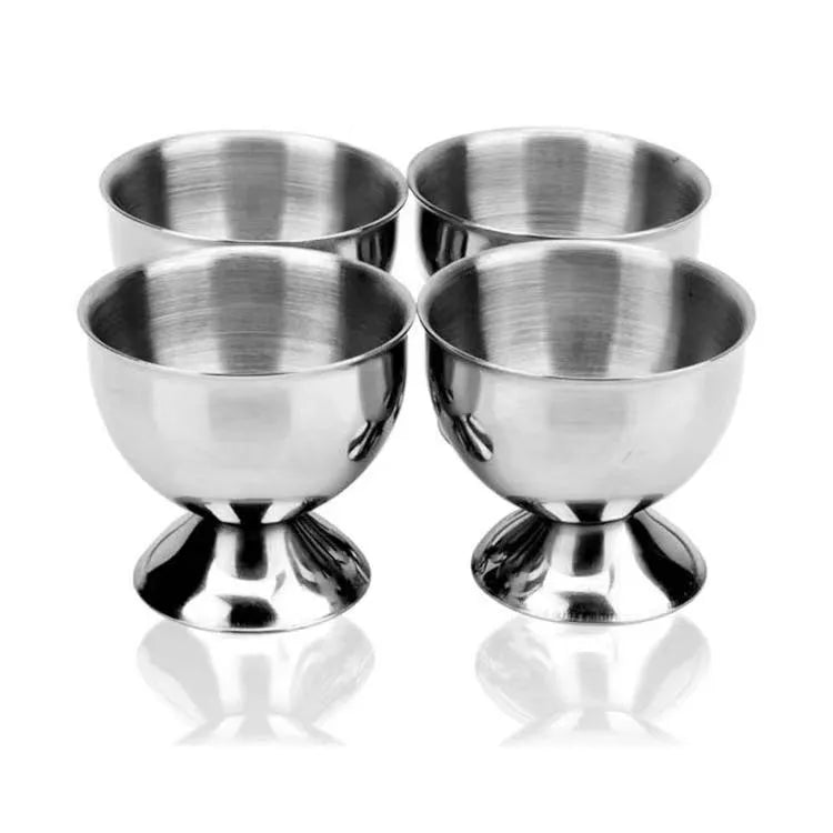 Creative stainless steel egg bracket in silver finish, holding eggs on a kitchen countertop.