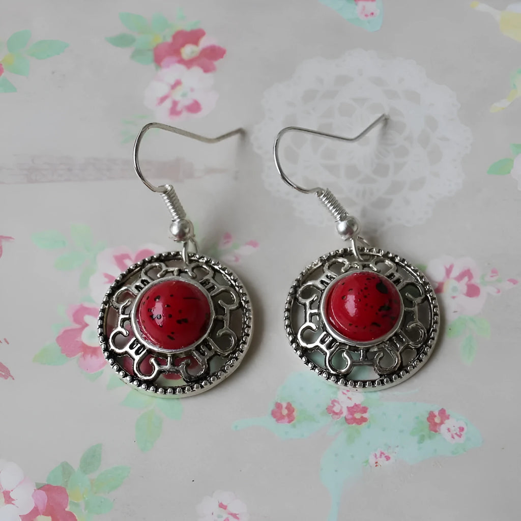 Handmade Tibetan silver earrings with turquoise geometric flower disk design in Miao ethnic style