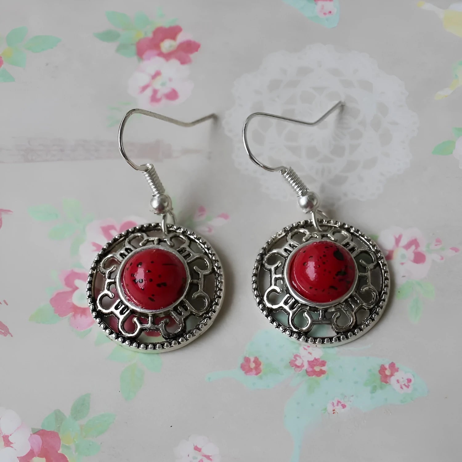 Handmade Tibetan silver earrings with turquoise geometric flower disk design in Miao ethnic style
