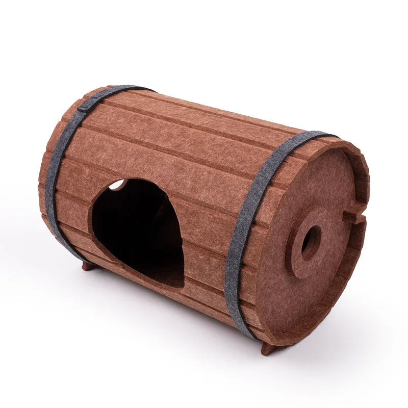 DIY assembled wine barrel shaped cat bed made from grey felt pieces with binding straps.