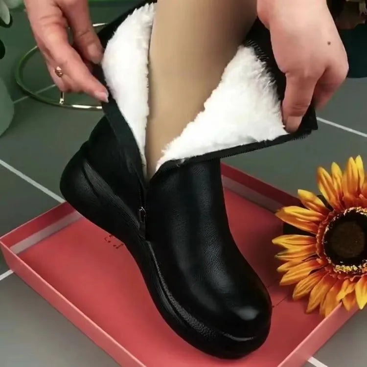 Retro British style flat boots with cowhide upper, side zipper, and metal decorative accents on a low tube silhouette.