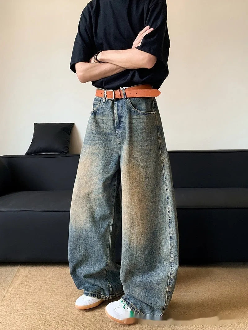 Men's retro blue distressed denim jeans with slim wide-leg fit showing micro elasticity fabric