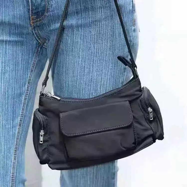 Black PU women's shoulder bag with side line detail, showing double pockets and measuring 24cm long.