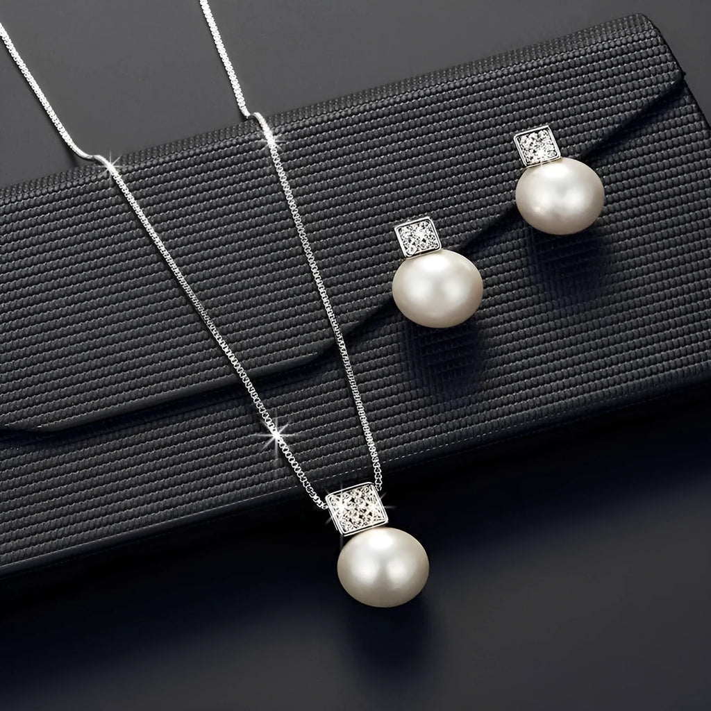 Versatile jewellery set with necklace and earrings featuring rhinestone cube pendants in rose gold finish