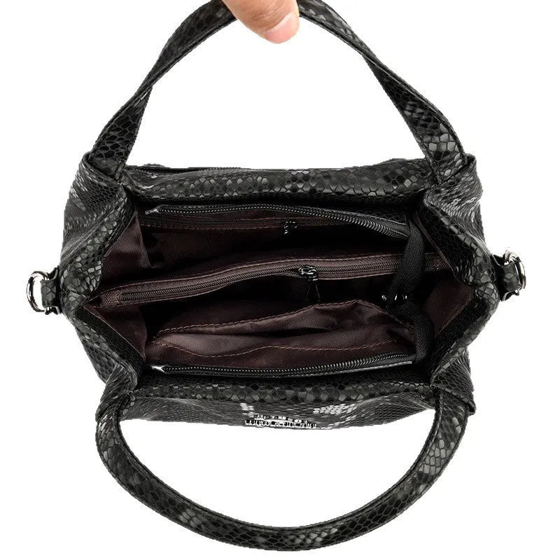 Genuine leather horizontal square shoulder bag with chain detail and snakeskin texture, multiple zippered compartments, available in various colours