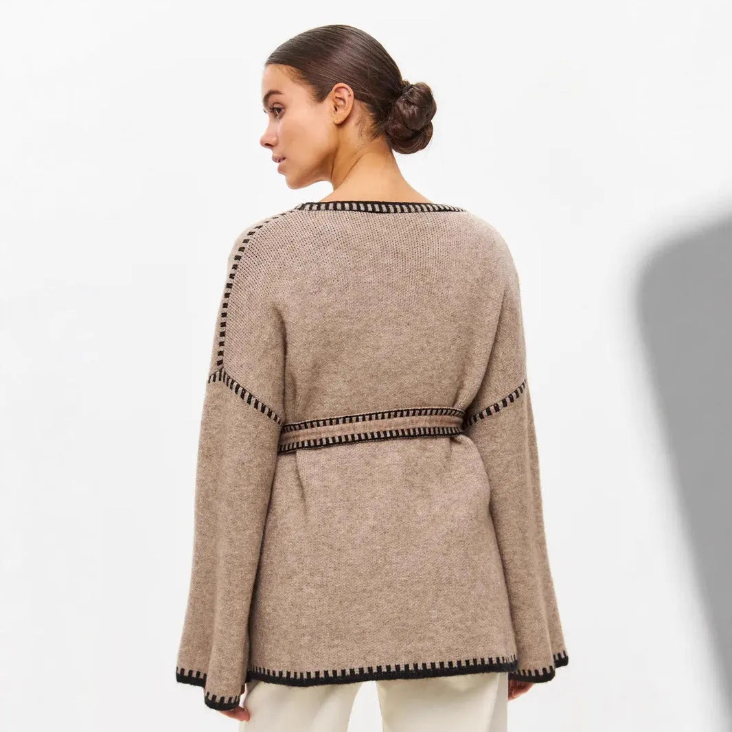 Loose lace-up front knitted cardigan in camel colour, showing mid-length fit and long sleeves.